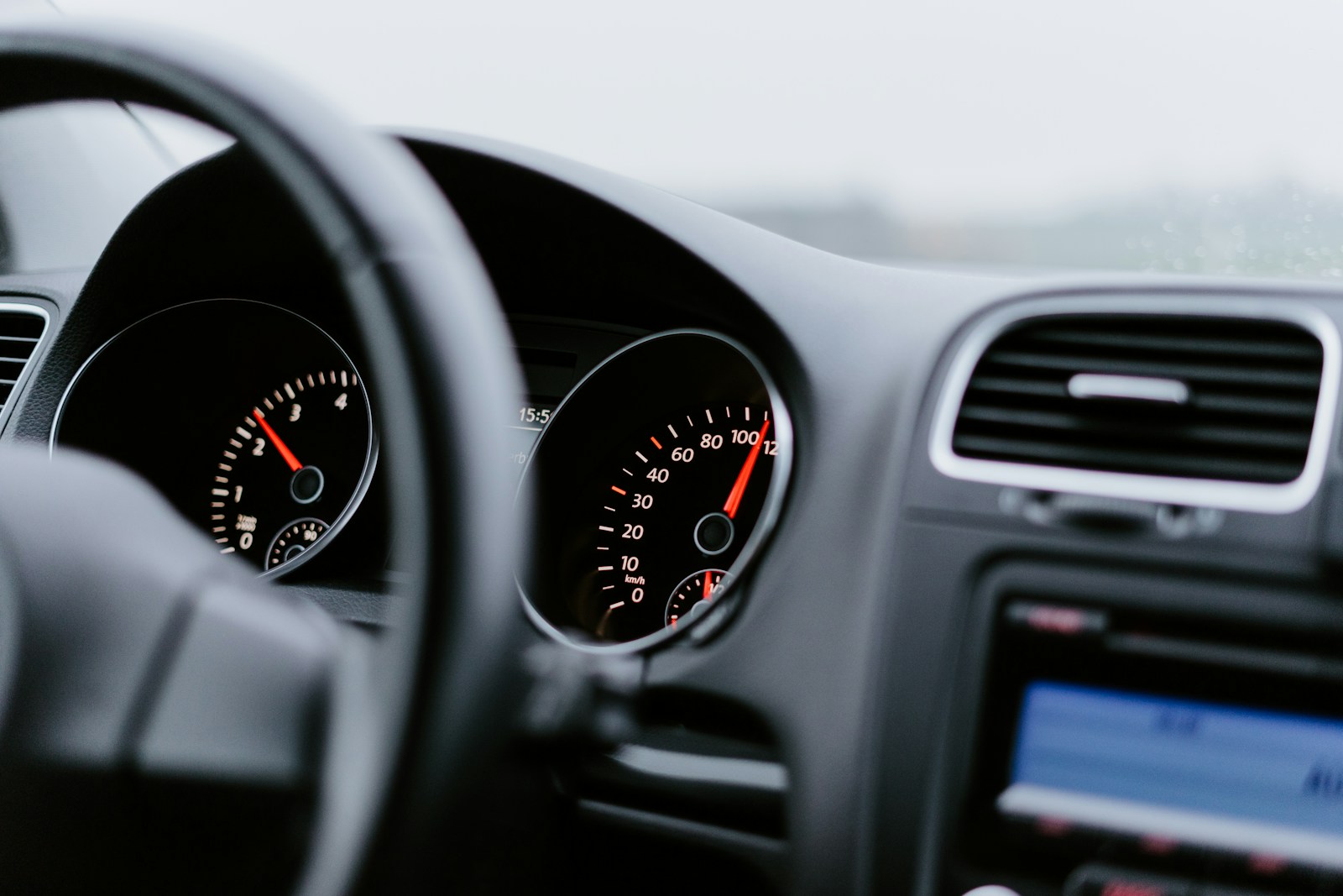 black vehicle dashboard with speedometer on 100, auto insurance